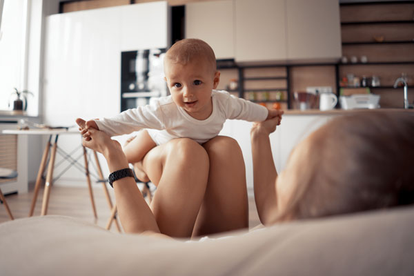 Parent playing with baby