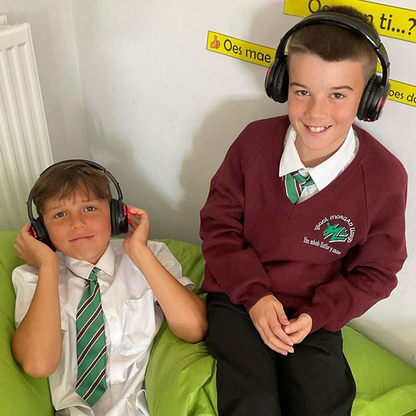 School children wearing headphones to learn Welsh